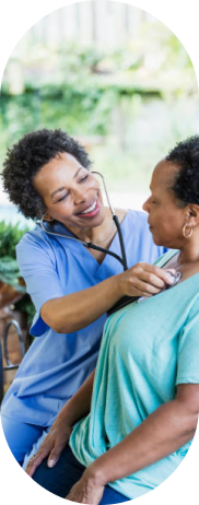 A nurse checking a patient's heartbeat with a stethoscope